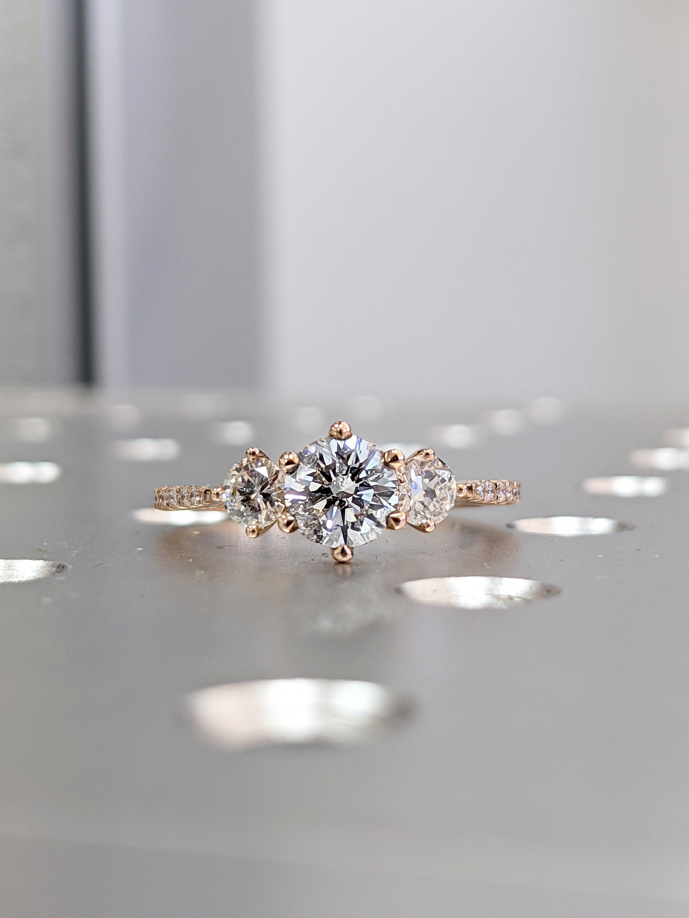 Tiffany and Co. Three-Stone Round Brilliant Diamond Halo Engagement Tiffany and Co. Three-Stone Round Brilliant Diamond Halo Engagement