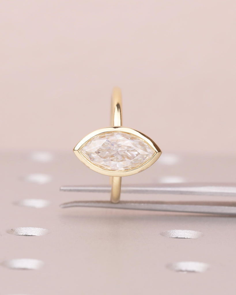 Minimalist 18k Gold Marquise Moissanite Engagement Ring in Bezel Setting image #1