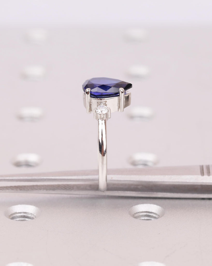 Pear Cut Blue Sapphire Engagement Ring with Diamond Accents, Platinum Three Stone Ring image #17