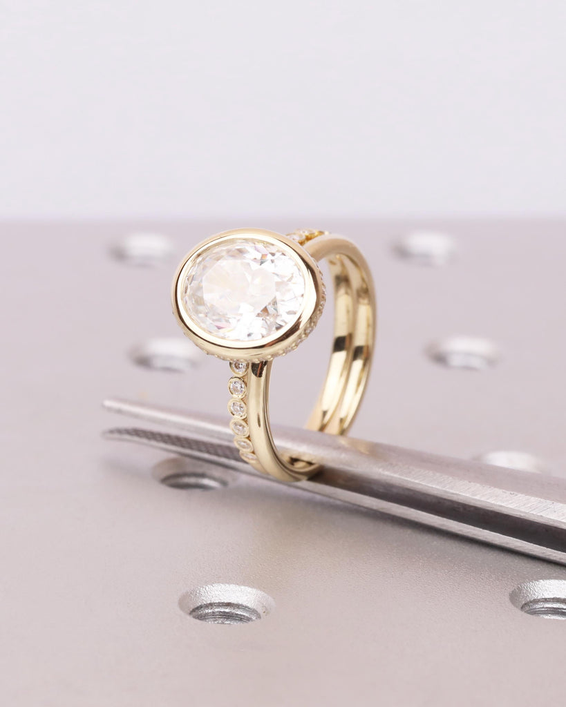 Oval Lab Diamond Bridal Ring Set: Bezel Engagement Ring with Hidden Halo, Half Eternity Bezel Wedding Band, 14K Gold Engagement Ring Set image #1