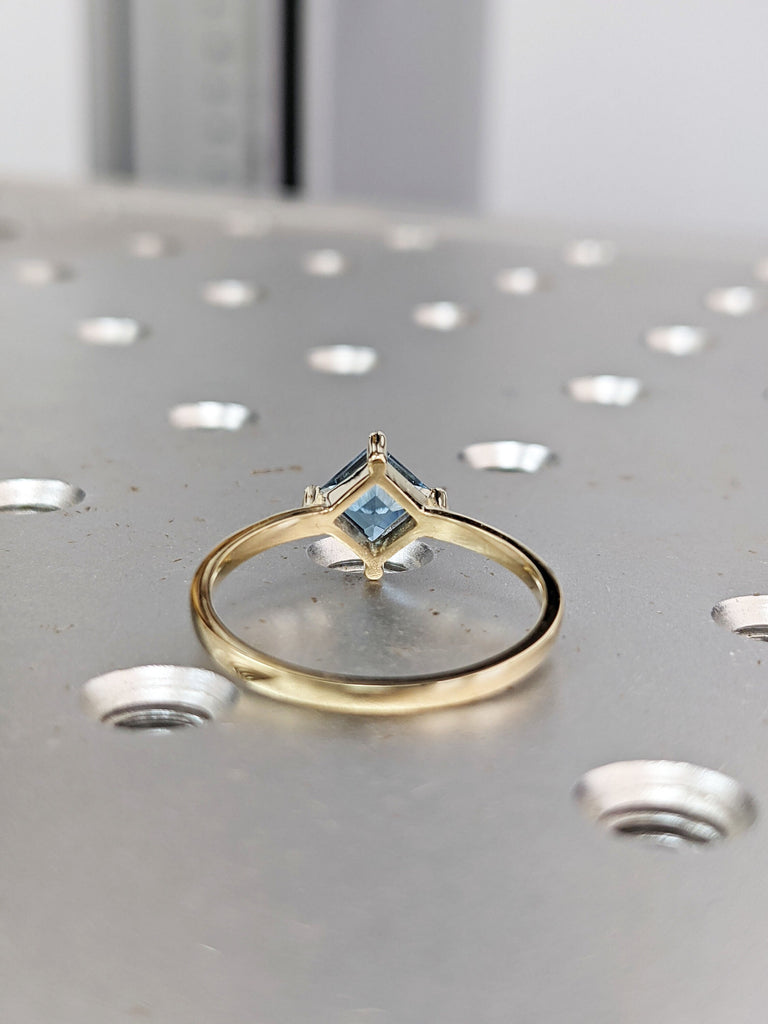 14k yellow gold Aria thin princess cut blue topaz ring offset prongs, delicate band, unique setting