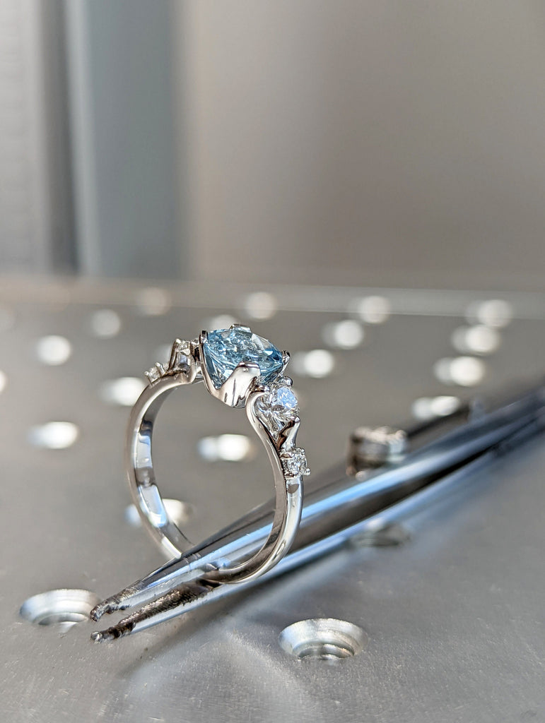 White Gold Three Stone Aquamarine And Diamond Ring (1/2 Ct. Tw.) Three Stone Setting Engagement Ring High Profile Unique Setting Brianna