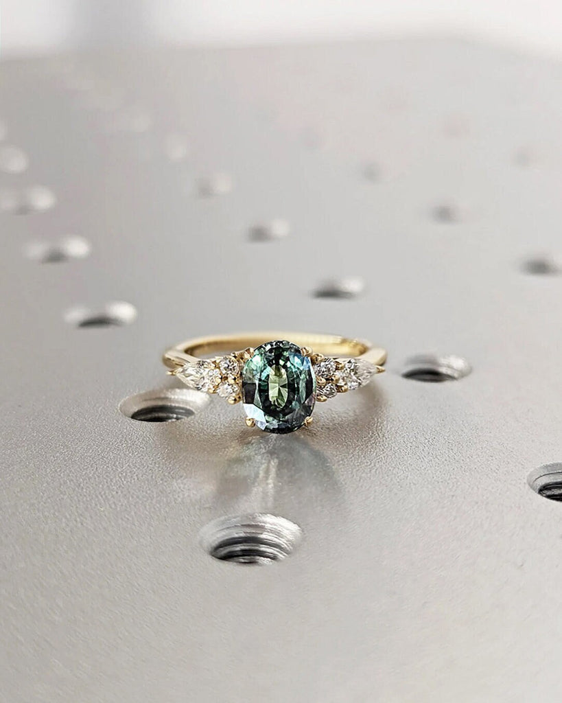 Blue Green sapphire ring. Peacock engagement ring. Oval Teal sapphire ring. 14k yellow gold engagement ring. Cluster diamond ring. Art deco.