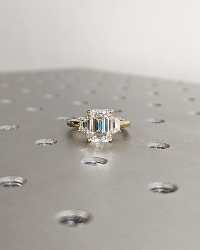 Emerald Cut Moissanite Engagement Ring. Three Stone Design with Trapezoid Accents. Unique Trellis Setting for Elegant Three Stone Ring Women