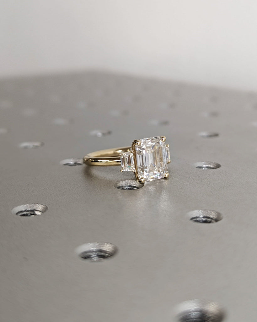 Emerald Cut Moissanite Engagement Ring. Three Stone Design with Trapezoid Accents. Unique Trellis Setting for Elegant Three Stone Ring Women