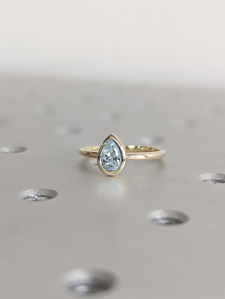 Bezel Set Pear cut Ice Blue Lab Grown Aquamarine Solitaire 14K Yellow Gold Engagement Ring