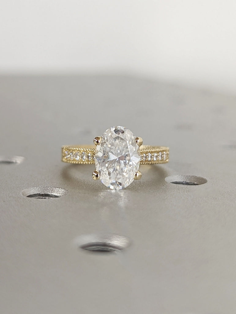 2ct Oval Simulan Diamond Solitaire Engagement Ring with Milgrain and Engraved Leaf Motif